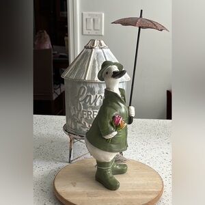 Duck figurine with an umbrella